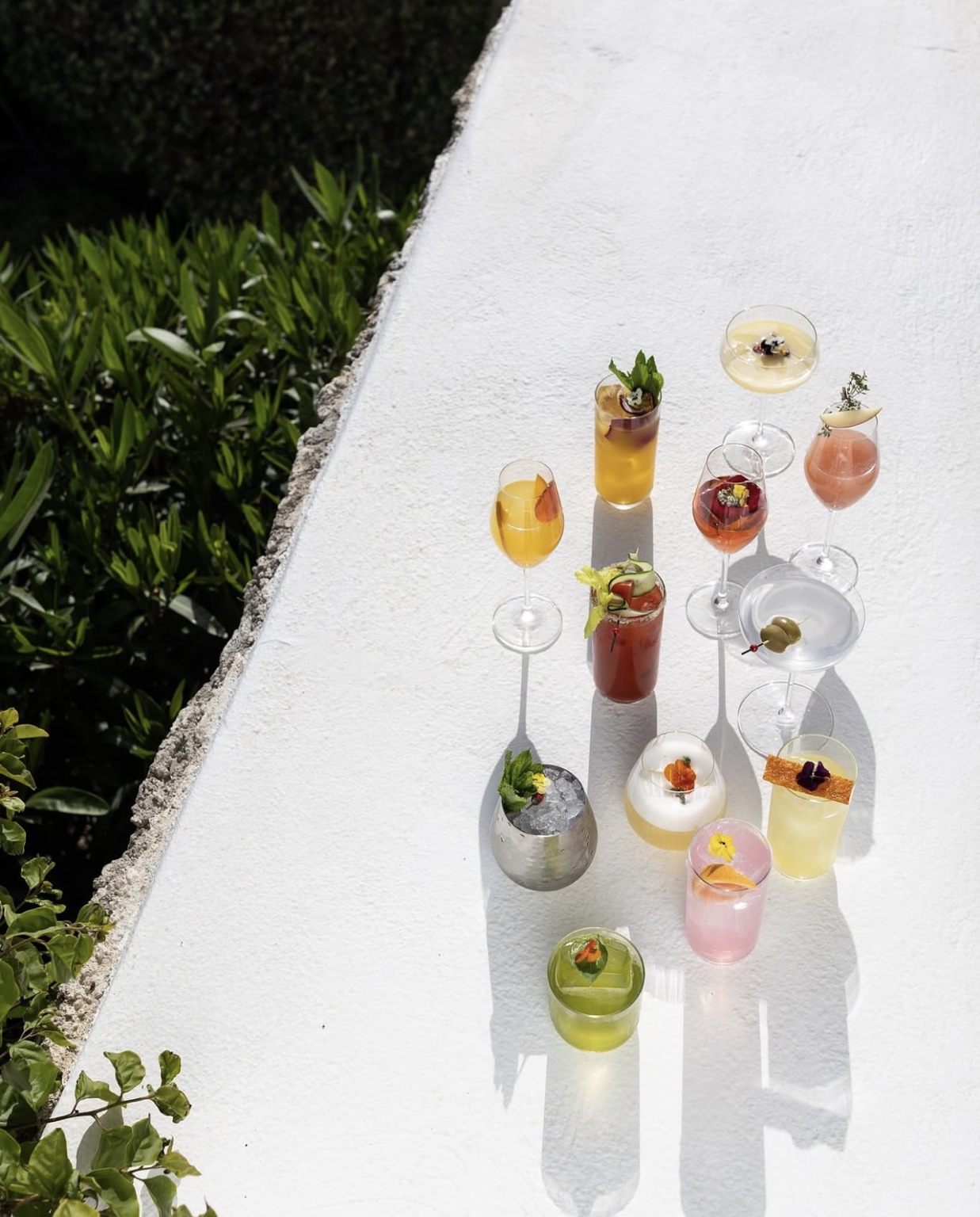 Hotel cocktail selection presented in a Mediterranean setting