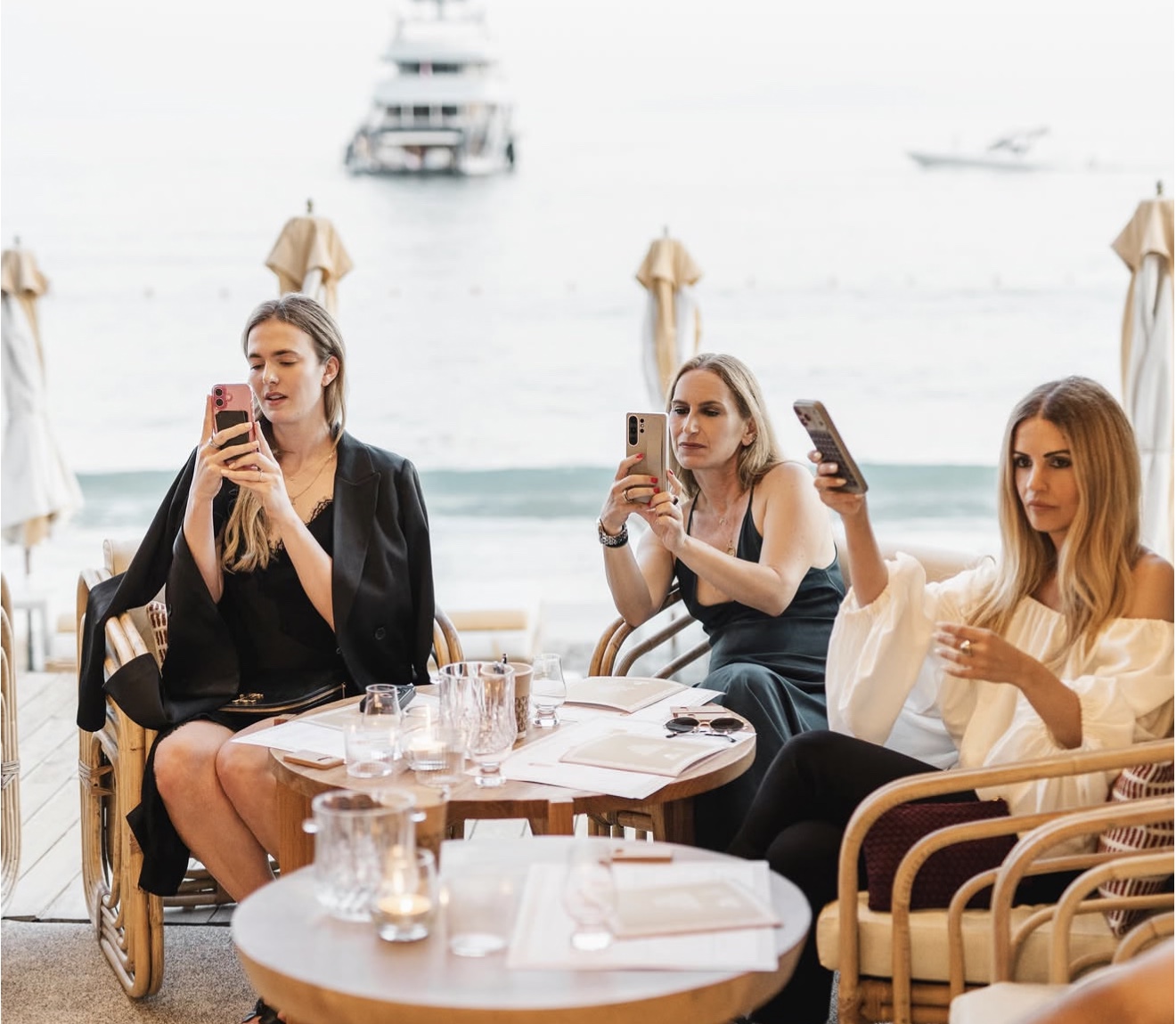 Guests documenting the private cocktail presentation in Mykonos